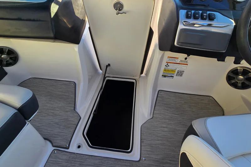 Slide: The Image of Interior view of a 2019 Regal 2000 ES Bowrider boat cockpit area. - 55
