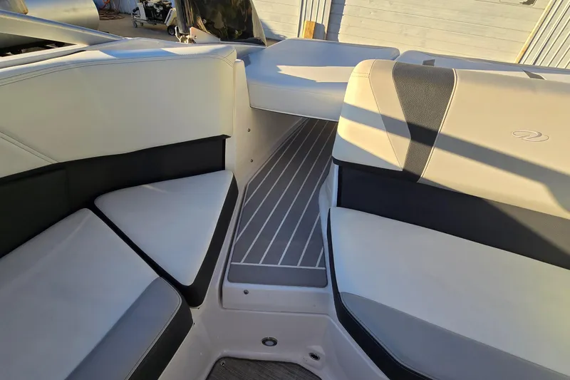 Slide: The Image of Interior of 2019 Regal 2000 ES Bowrider boat with cushioned seating. - 57