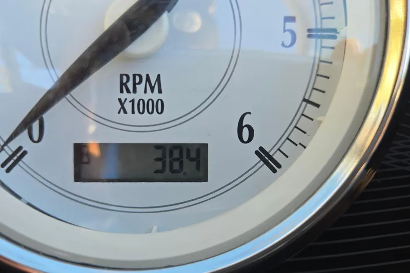 Slide: The Image of Close-up of a Regal 2000 ES Bowrider 2019 tachometer showing 384 RPM. - 66