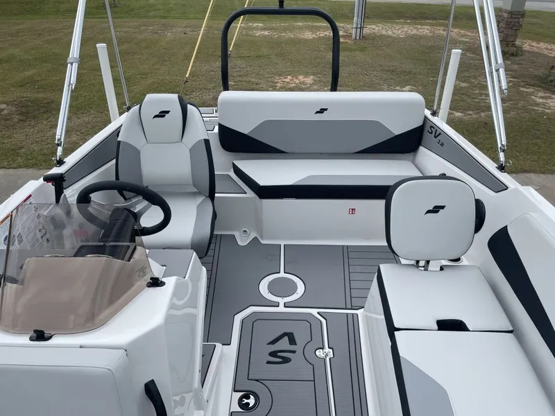 Slide: The Image of Interior of 2026 Starcraft SV 18 OB boat, featuring modern seating and controls. - 11