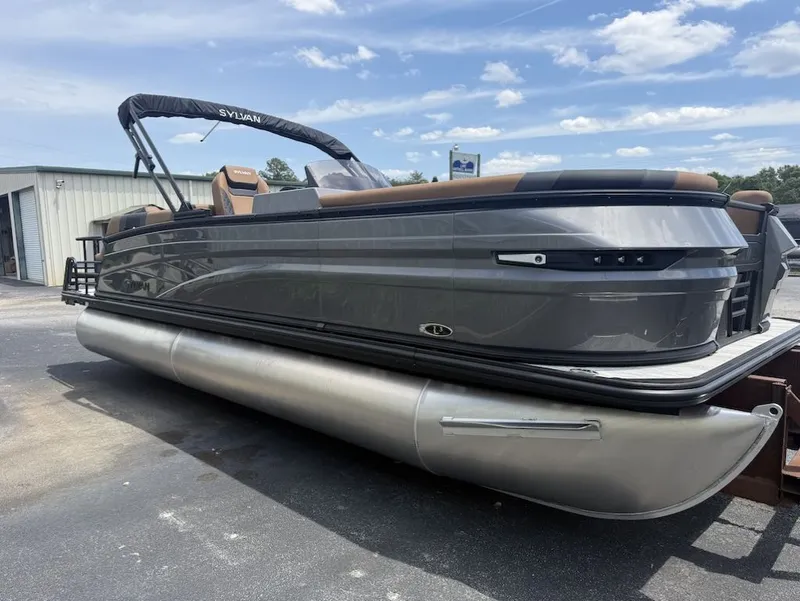 Slide: The Image of 2026 Sylvan L-3 LZ DH pontoon boat on parking lot. - 4