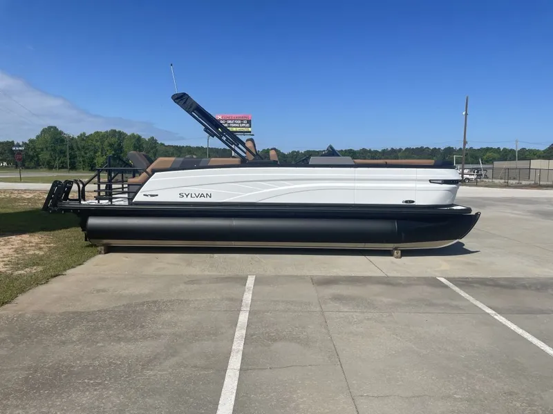 The Image of 2026 Sylvan L-3 LZ DH pontoon boat parked on a sunny day. - 1
