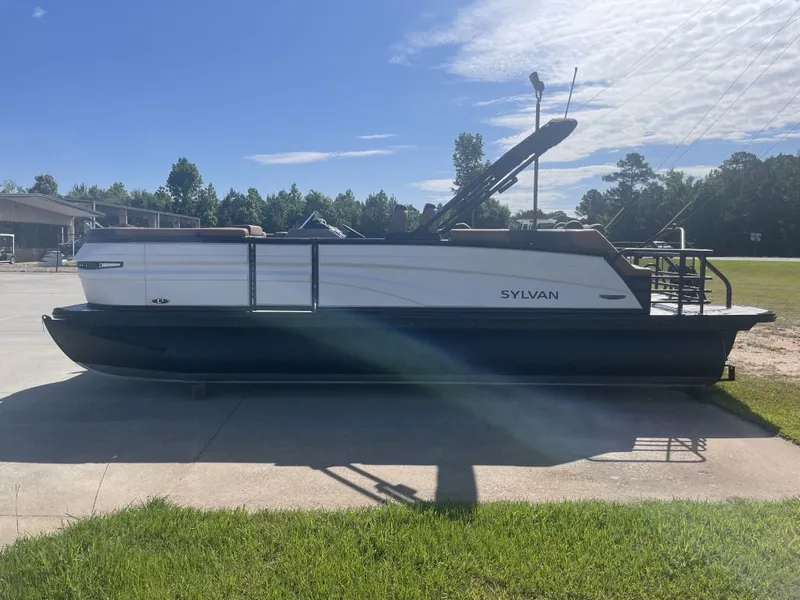 Slide: The Image of 2026 Sylvan L-3 LZ DH pontoon boat on concrete surface in sunlight. - 3