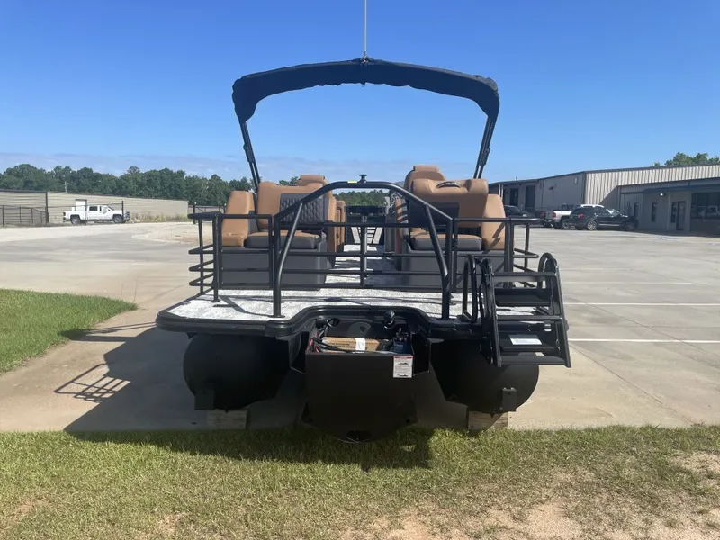Slide: The Image of 2026 Sylvan L-3 LZ DH pontoon boat parked under sunny skies. - 4