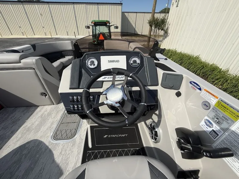 Slide: The Image of Interior view of Starcraft SLS 3 Q DH 2026 boat cockpit. - 17
