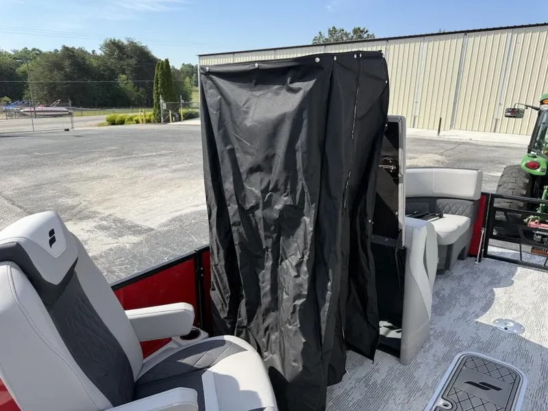 Slide: The Image of Interior of 2026 Starcraft SLS 3 Q DH with seating and curtain. - 18