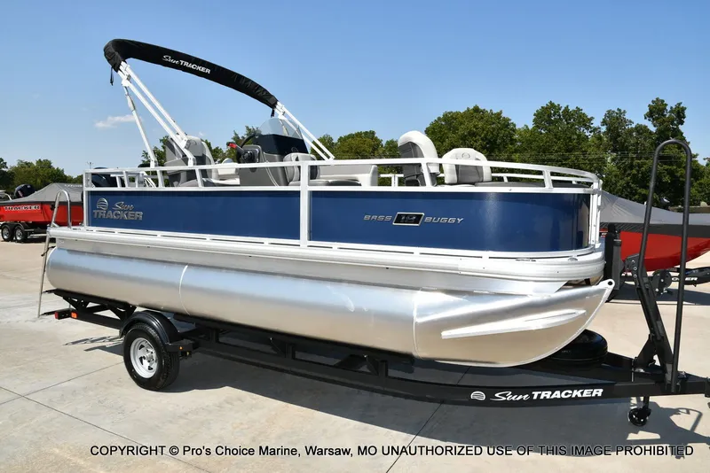 The Image of 2026 Sun Tracker Bass Buggy 18 DLX pontoon boat on trailer. - 1