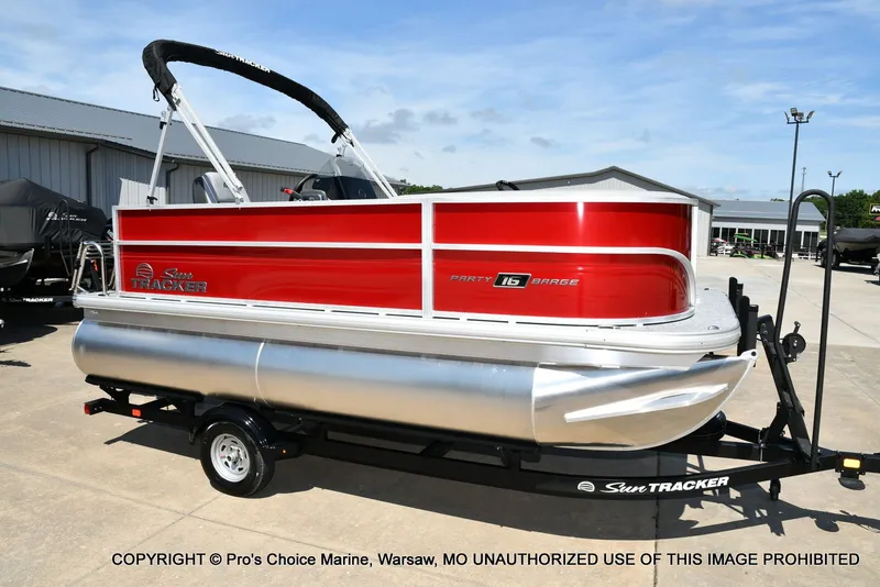 The Image of 2026 Sun Tracker Party Barge 16 on trailer, red design. - 1