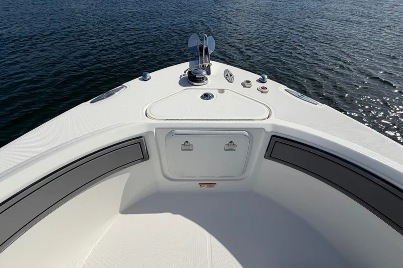 Slide: The Image of Bow of 2014 Wellcraft 35 Scarab Tournament boat on calm water. - 10