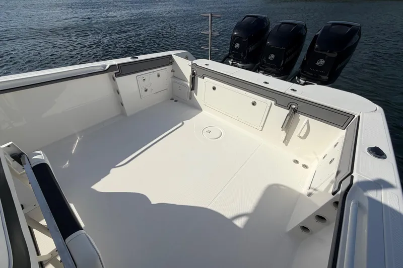 Slide: The Image of 2014 Wellcraft 35 Scarab Tournament boat deck with triple Mercury outboard engines. - 14