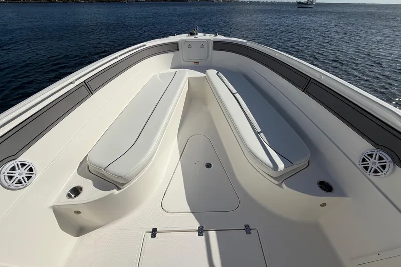 Slide: The Image of 2014 Wellcraft 35 Scarab Tournament boat interior with cushioned seating and ocean view. - 9