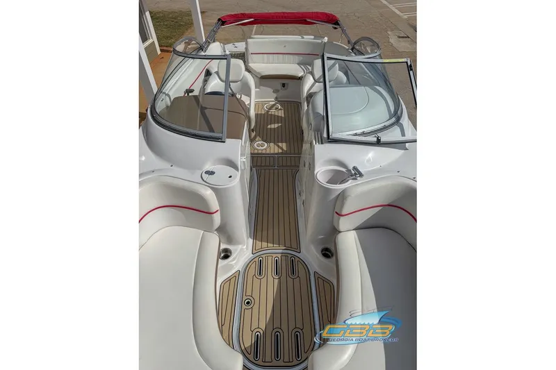 Slide: The Image of 2008 Four Winns F224 boat interior with sleek seating and wood-style flooring. - 10