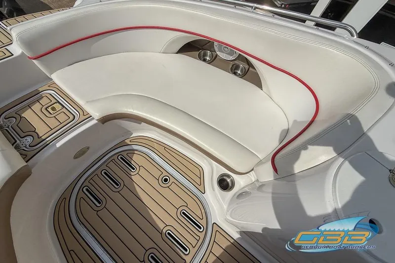 Slide: The Image of 2008 Four Winns F224 boat interior with white seating and teak-style flooring. - 11