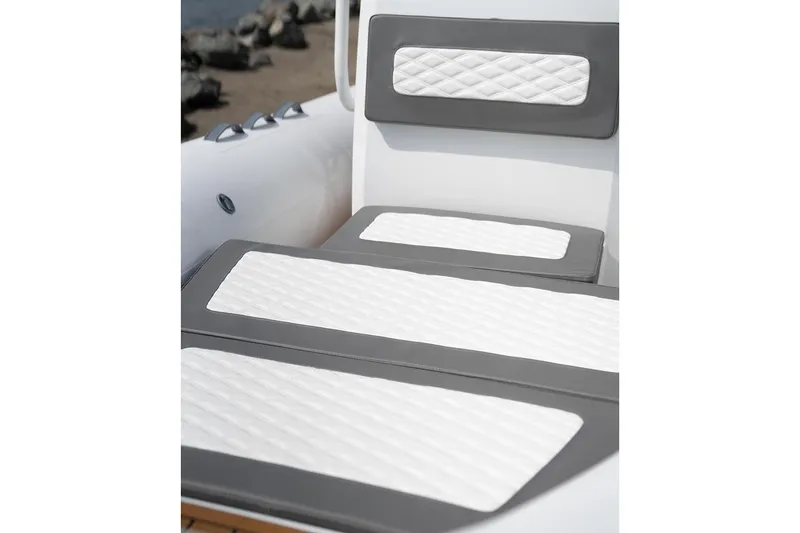 Slide: The Image of Manufacturer Provided Image: 2025 Tide Craft Galveston 19 boat seating with gray and white cushioned design. - 10