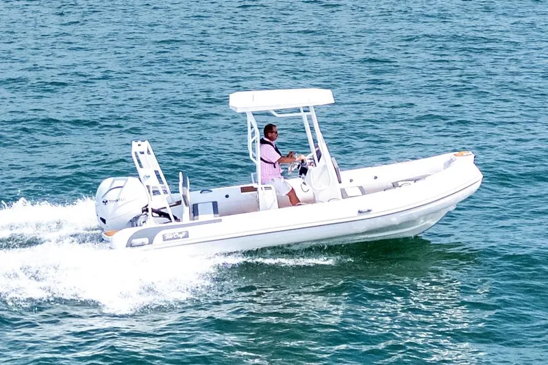 Slide: The Image of Manufacturer Provided Image: 2025 Tide Craft Galveston 19 boat cruising on open water. - 2