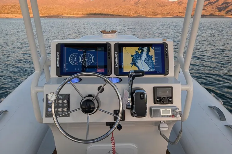 Slide: The Image of Manufacturer Provided Image: Tide Craft Galveston 19 boat dashboard with navigation screens, steering wheel, and controls, 2025 model. - 4