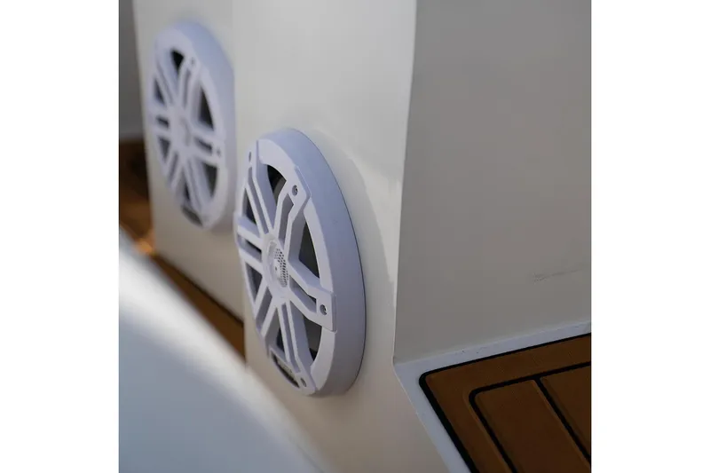 Slide: The Image of Manufacturer Provided Image: Speakers on a 2025 Tide Craft Galveston 19 boat, featuring sleek design and wood accents. - 9