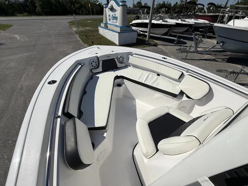 Slide: The Image of Interior view of 2026 Tidewater 210 LXF boat with white seating. - 7