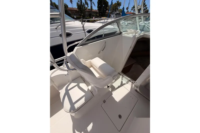 Slide: The Image of 2008 Robalo R225 Walkaround boat interior with seating and cabin entrance. - 11