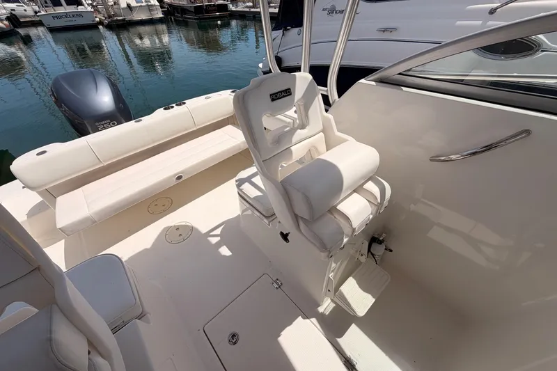 Slide: The Image of 2008 Robalo R225 Walkaround boat interior with seating and Yamaha 250 engine. - 12