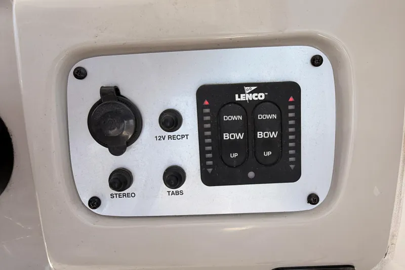 Slide: The Image of Control panel of a 2008 Robalo R225 Walkaround boat with Lenco trim tab switches. - 17