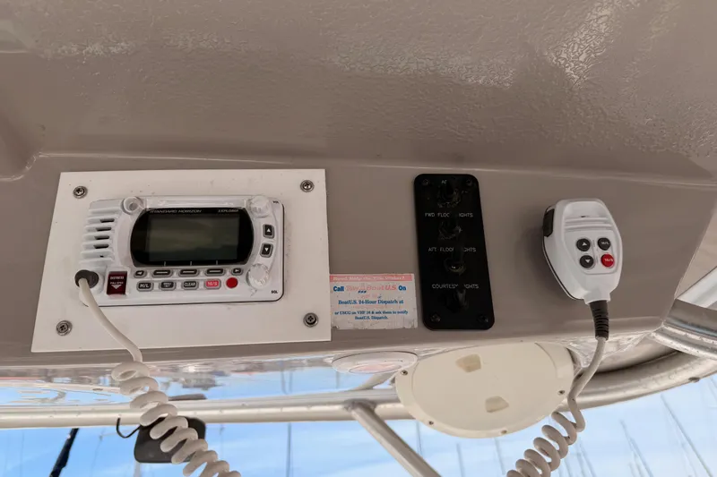 Slide: The Image of 2008 Robalo R225 Walkaround boat dashboard with radio and control panel. - 24