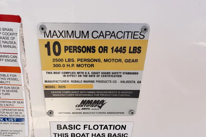 Slide: The Image of 2008 Robalo R225 Walkaround capacity plate, 10 persons or 1445 lbs, 300 HP motor. - 25
