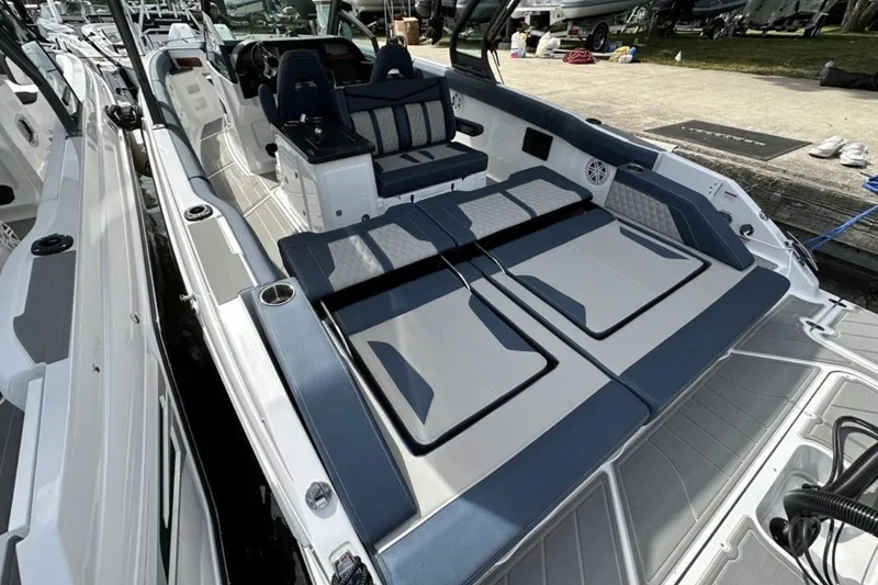 Slide: The Image of 2025 Monterey Elite 30 OB boat interior with luxurious seating and modern design. - 12