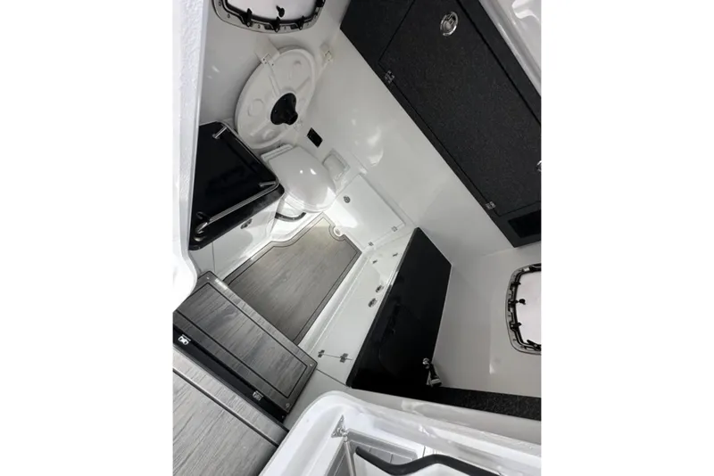 Slide: The Image of 2025 Monterey Elite 30 OB boat interior with modern bathroom amenities and sleek design. - 17