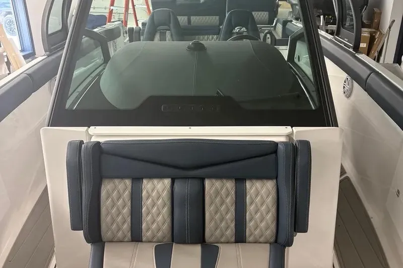 Slide: The Image of 2025 Monterey Elite 30 OB boat interior with luxurious seating and modern design. - 5