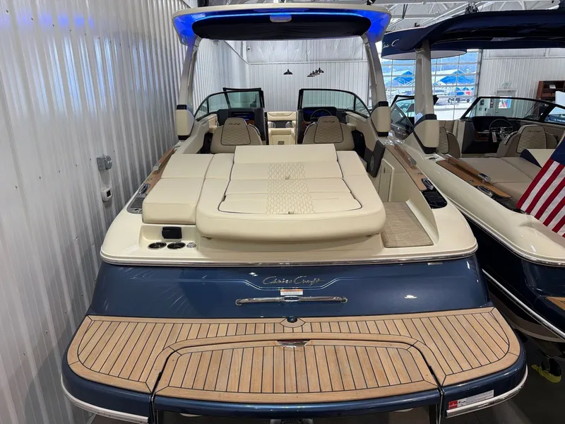 The Image of 2026 Chris-Craft Sportster 28 boat with luxurious design in showroom. - 1