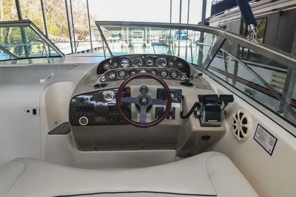 Slide: The Image of Cockpit of 1999 Rinker Fiesta Vee 330 boat with steering wheel and instrument panel. - 21