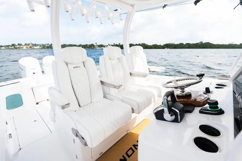 Slide: The Image of Manufacturer Provided Image: Luxury interior of 2025 Phenom 37 boat with plush seating and modern controls. - 13