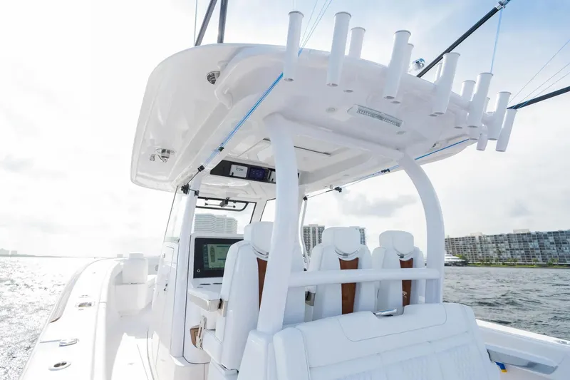 Slide: The Image of Manufacturer Provided Image: 2025 Phenom 37 boat with sleek design and modern seating on open water. - 14