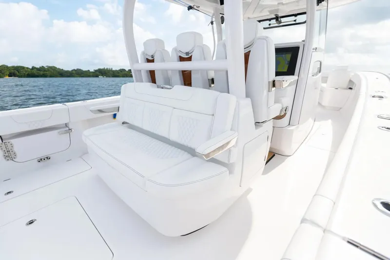 Slide: The Image of Manufacturer Provided Image: Luxury seating on 2025 Phenom 37 boat, featuring sleek white design and advanced navigation. - 15