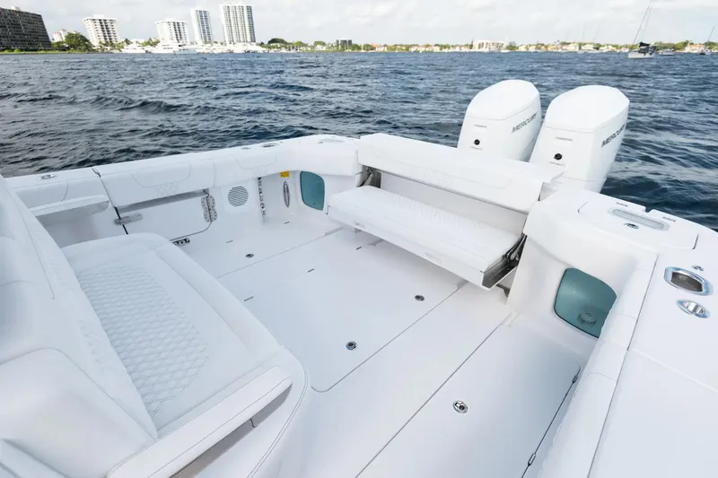 Slide: The Image of Manufacturer Provided Image: Spacious deck of 2025 Phenom 37 boat with dual engines on open water. - 19