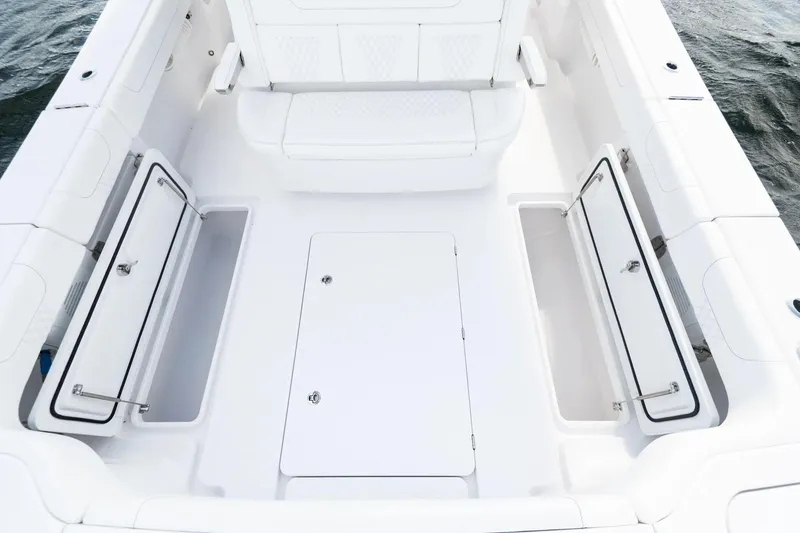 Slide: The Image of Manufacturer Provided Image: Spacious deck of 2025 Phenom 37 boat with open storage compartments. - 20