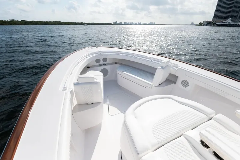 Slide: The Image of Manufacturer Provided Image: Luxurious 2025 Phenom 37 yacht with sleek white seating on open water. - 6