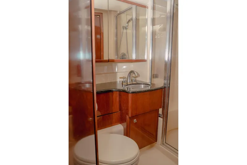 Slide: The Image of Luxurious bathroom in 2008 Meridian 341 Sedan yacht with wood cabinetry and modern fixtures. - 10