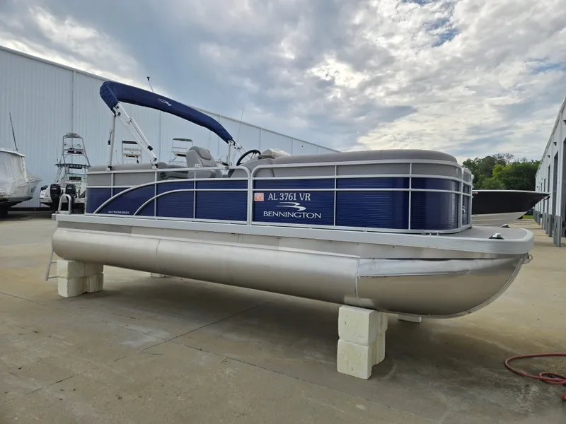 The Image of 2022 Bennington 22SVSRST pontoon boat on a dock. - 0