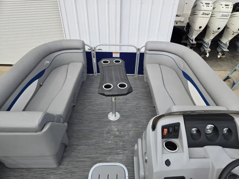 Slide: The Image of Interior of a 2022 Bennington 22SVSRST pontoon boat with gray seating. - 2