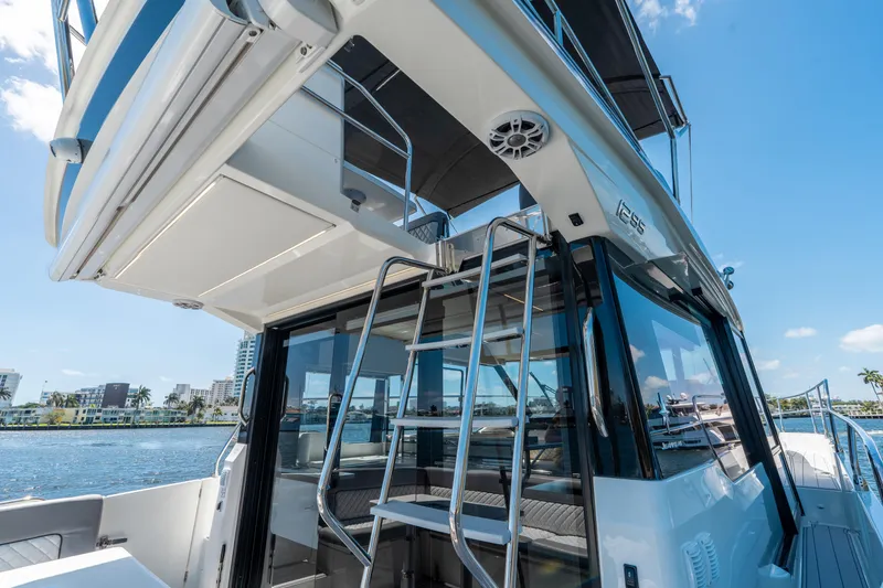 Slide: The Image of 2024 Jeanneau NC 1295 Fly yacht with sleek design and modern flybridge. - 24