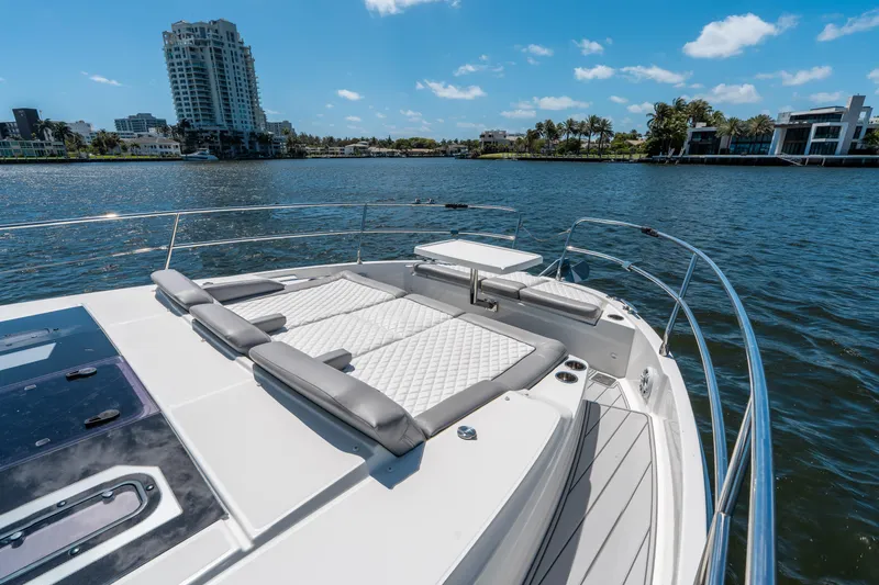 Slide: The Image of 2024 Jeanneau NC 1295 Fly yacht with luxurious sunbathing area on a sunny day. - 28
