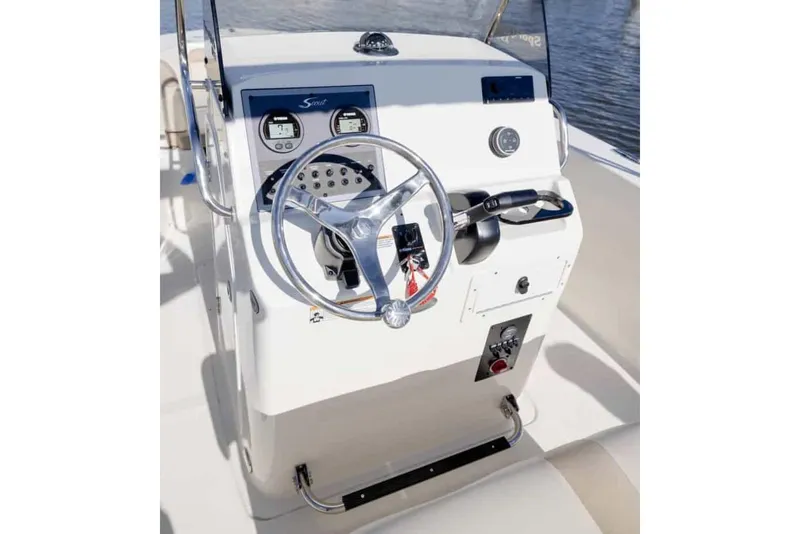 Slide: The Image of 2025 Scout 195 Sportfish boat interior with steering console and seating. - 6