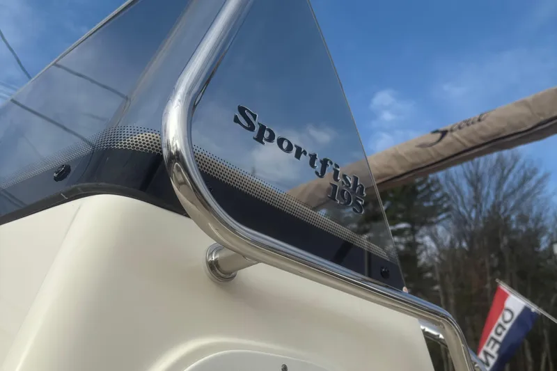 Slide: The Image of 2025 Scout 195 Sportfish boat interior with steering wheel and livewell. - 7