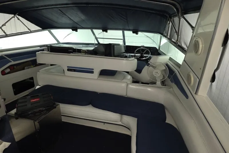 Slide: The Image of Interior of 1989 Sea Ray 420 Sundancer boat with blue and white seating. - 17