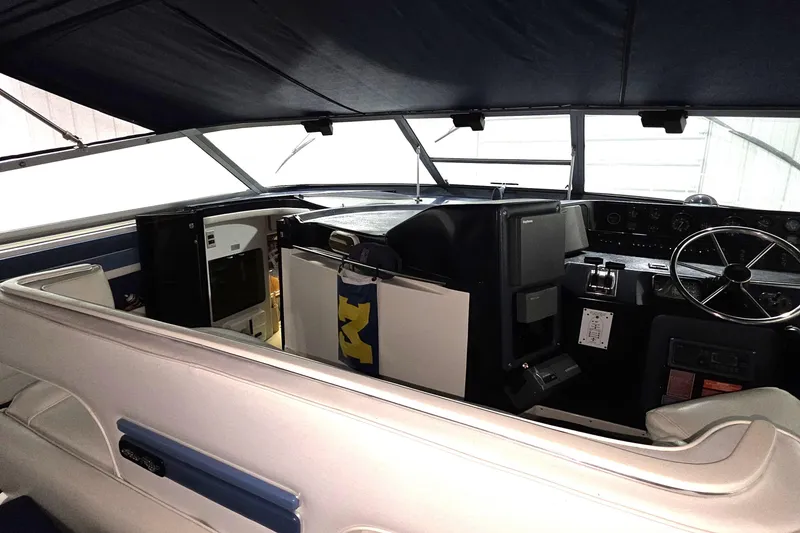 Slide: The Image of Interior view of 1989 Sea Ray 420 Sundancer boat cockpit with steering wheel and controls. - 18