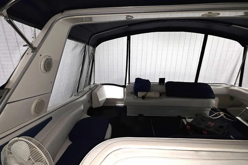 Slide: The Image of Interior of 1989 Sea Ray 420 Sundancer boat with seating and fan. - 24