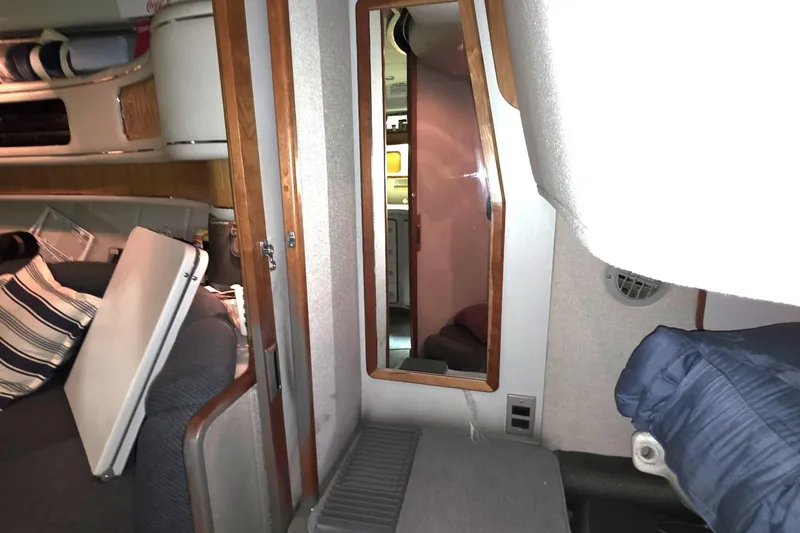 Slide: The Image of Interior of 1989 Sea Ray 420 Sundancer yacht with seating and mirror. - 26