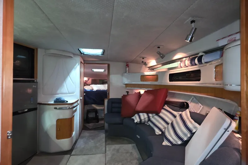 Slide: The Image of Interior of 1989 Sea Ray 420 Sundancer yacht with cozy seating and modern amenities. - 27